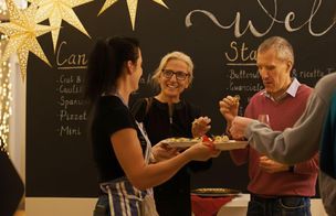 Homemade edible Christmas gifts displayed in the Dublin Cookery School kitchen — jars of chutney, biscuits, truffles, and mulled wine.