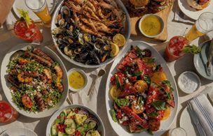 Seafood BBQ feast with grilled prawns, mussels, watermelon salad and summer sides — seafood BBQ class Dublin