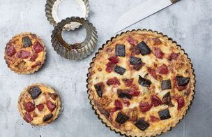 Chef seasoning a golden roast turkey with sea salt and herbs during a Christmas cooking class at Dublin Cookery School.