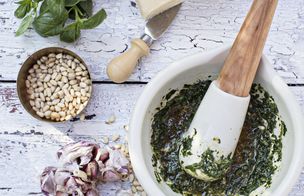 A top-down view of a homemade ramen bowl featuring soft-boiled eggs, sliced roast pork, and nori, demonstrating advanced healthy cooking techniques.