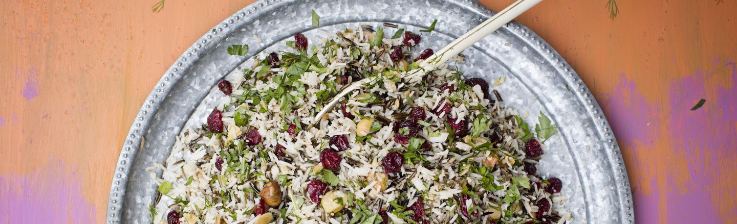 Plate of star-shaped Christmas biscuits and glasses of sparkling drinks with pomegranate seeds, styled for Dublin Cookery School’s festive season.